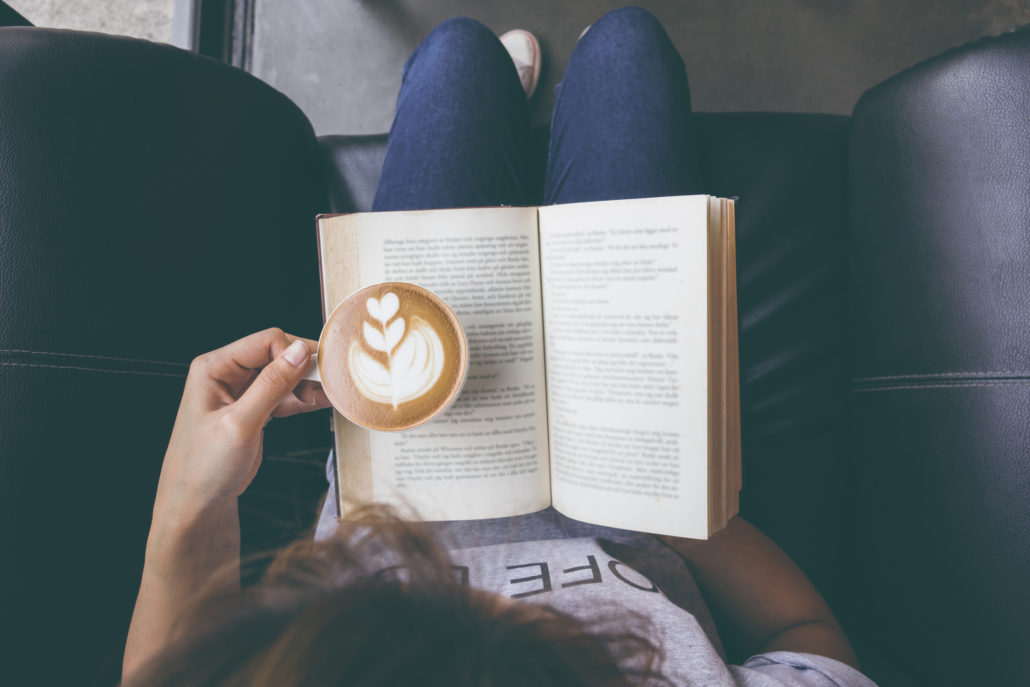 Girl reading with coffee