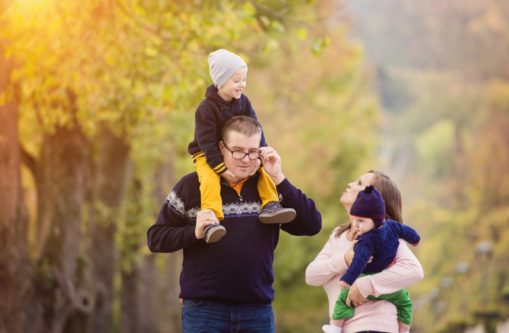 family in city park during the fall
