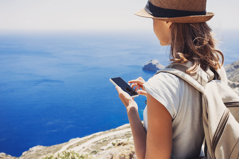 hiking kid using mobile phone