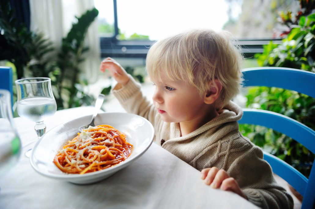 eating pasta in indoors restaurant