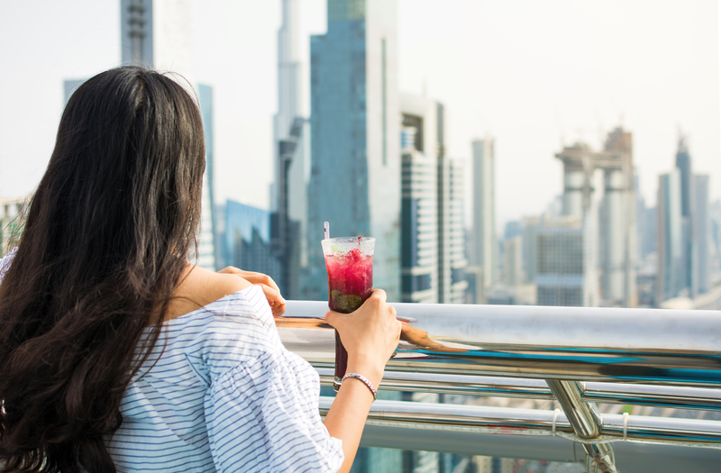 Girl having a drink with Dubai