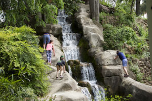 Climbing the Grotto waterfall in Maria Luisa Park, Seville