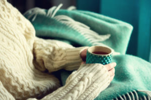 Woman holding cup of tea with lemon © Yuliia Chyzhevska | Dreamstime.com