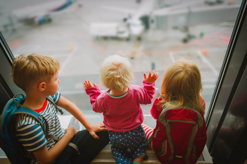 kids waiting for plane in airport. 